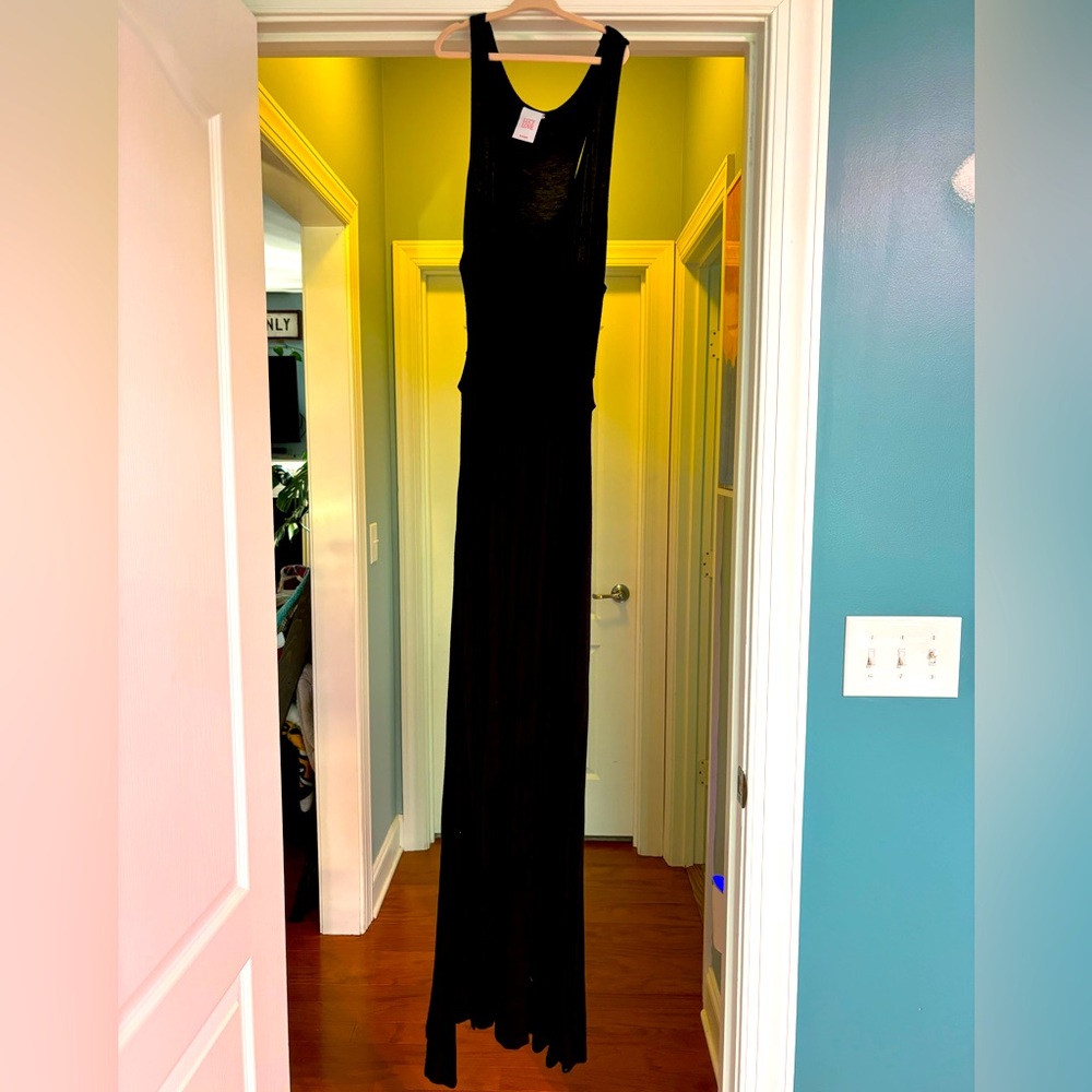 Black maxi dress with openings on each side in rib area
